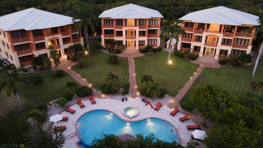 Villas at CocoPlum in Placencia Belize - Evening aerial with exterior lights illuminated