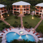 Villas at CocoPlum in Placencia Belize - Evening aerial with exterior lights illuminated